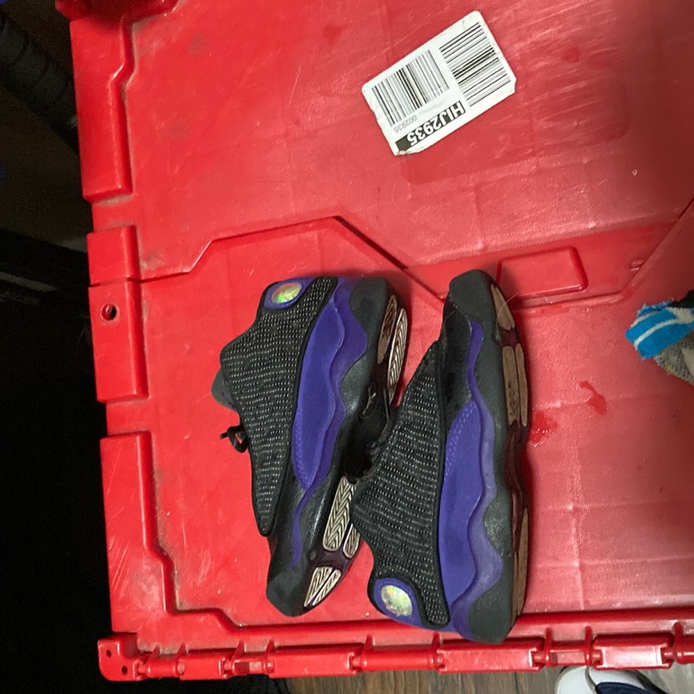 Size9 in kids purple and black Jordan’s
